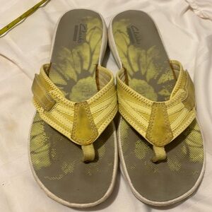 Gently used Yellow Clarks adjustable sandles size 10 ..